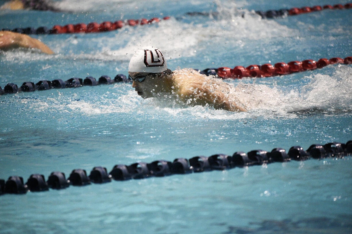 Sam Empey of Union swims to victory in the 100 butterfly at the 4A boys swimming state meet in Federal Way on Saturday, Feb. 18, 2023.