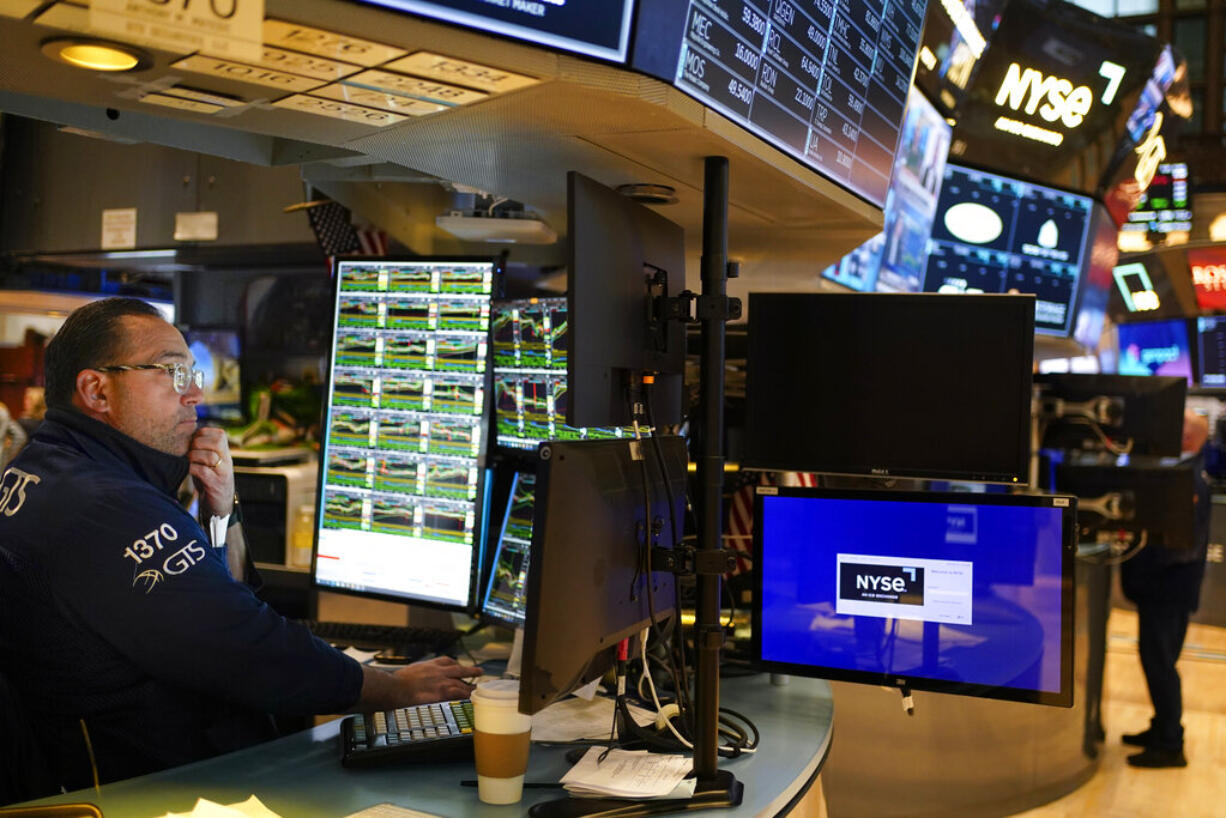 Traders work on the floor at the New York Stock Exchange in New York, Wednesday, Feb. 1, 2023.