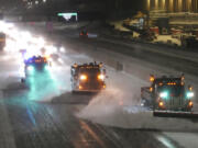 Snow plows move snow from I-35W southbound, seen from the 42nd St. Bridge, as the metro and much of the state prepares for a winter storm, on Wednesday, Feb. 22, 2023 in Minneapolis. Brutal winter weather bringing snow, dangerous gusts of wind and bitter cold settled over much of the northern U.S. on Wednesday, shutting down roadways, closing schools and businesses and prompting dire warnings for people to stay home.