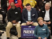 Members of the Faith and Family advocacy group, listen to speakers during a rally in the rotunda of the Kentucky State Capitol in Frankfort, Ky., Thursday, Feb. 16, 2023. The Kentucky Supreme Court on Thursday refused to allow abortions to resume in the state, rejecting a request to halt a near total ban of the procedure. (AP Photo/Timothy D.