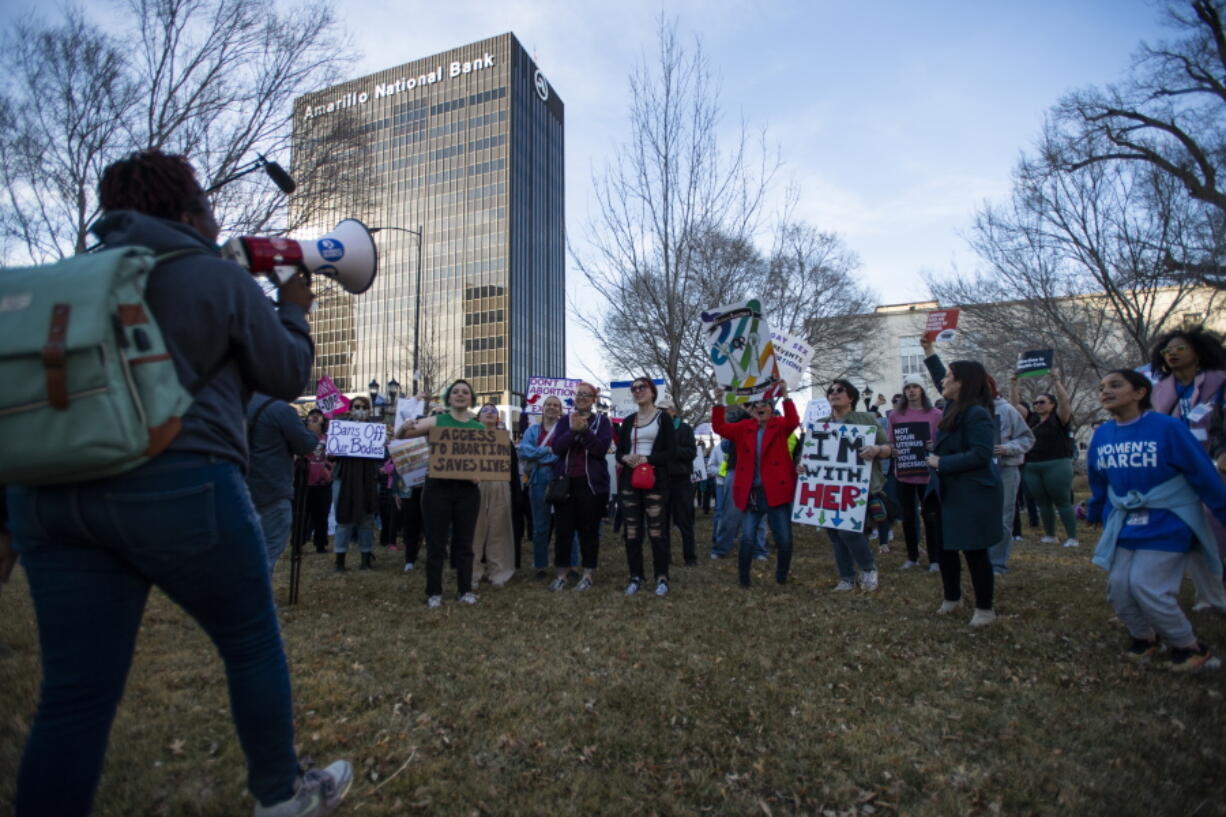 People gather in front of the J. Marvin Jones Federal Building and Mary Lou Robinson United States Courthouse to protest a lawsuit to ban the abortion drug mifepristone Saturday, Feb. 11, 2023, in Amarillo, Texas.