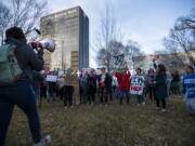 People gather in front of the J. Marvin Jones Federal Building and Mary Lou Robinson United States Courthouse to protest a lawsuit to ban the abortion drug mifepristone Saturday, Feb. 11, 2023, in Amarillo, Texas.