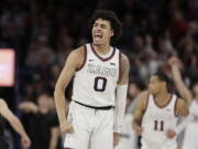 Gonzaga guard Julian Strawther (0) celebrates his basket during the second half of the team's NCAA college basketball game against BYU, Saturday, Feb. 11, 2023, in Spokane, Wash. Gonzaga won 88-81.