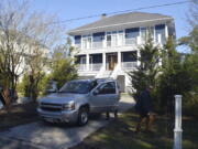 FILE - U.S. Secret Service agents are seen in front of Joe Biden's Rehoboth Beach, Del., home on Jan. 12, 2021. The FBI is conducting a planned search of President Joe Biden's Rehoboth Beach, Delaware home as part of its investigation into the potential mishandling of classified documents. That's according to a statement from Biden's personal lawyer.