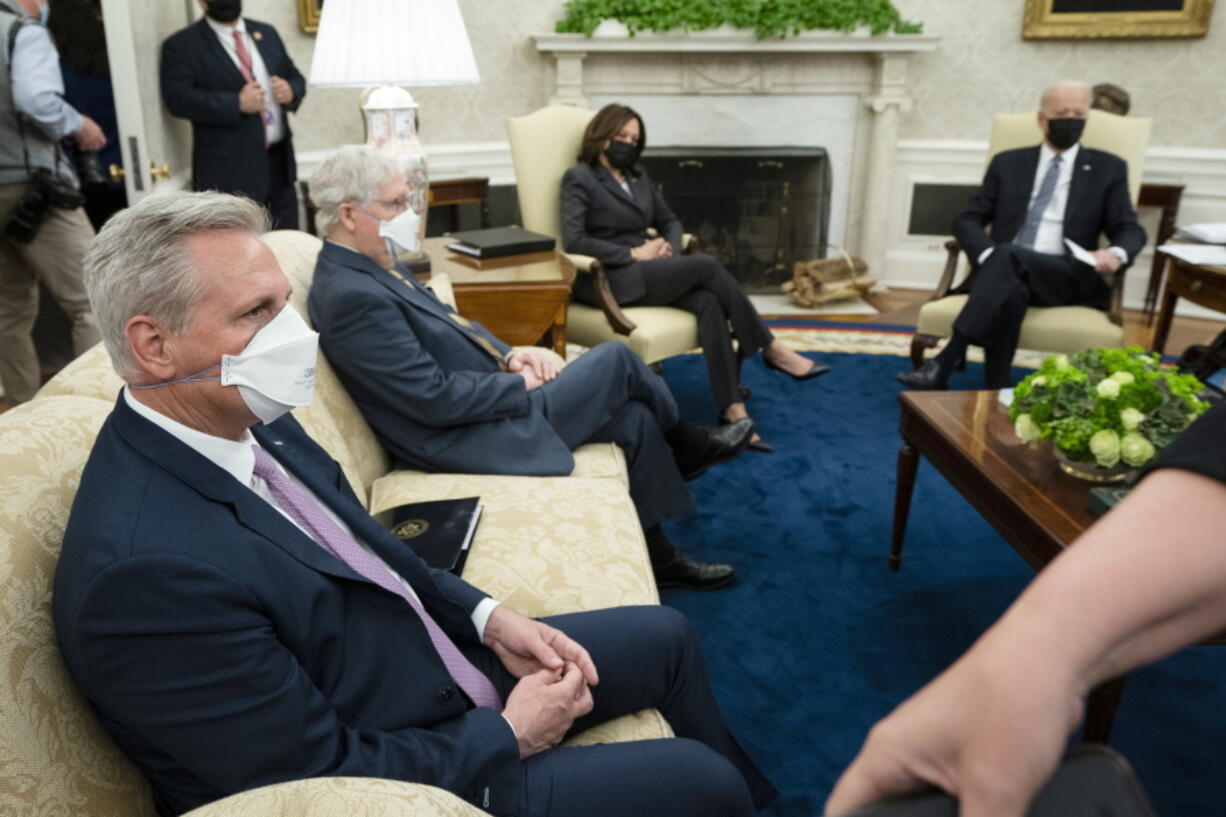 FILE - President Joe Biden, right, at the top of a meeting with congressional leaders to discuss legislative priorities for the rest of the year, Nov. 29, 2022, in the Roosevelt Room of the White House in Washington. From left are House Minority Leader Kevin McCarthy of Calif., Senate Majority Leader Chuck Schumer, of N.Y., and Biden. The president and the House speaker are preparing for their first official visit at the White House on Wednesday, ahead of a looming debt crisis.