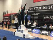 Camas junior Madi Williams stands atop to podium after winning the Class 4A all-around title at the WIAA State Gymnastics Championships on Friday, Feb. 24, 2023 at Sammamish High School in Bellevue.