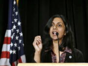 FILE - New Seattle City Councilmember Kshama Sawant speaks during an inauguration ceremony for city officials Monday, Jan. 6, 2014, in Seattle. One of Sawant's earliest memories of the caste system was hearing her grandfather - a man she "otherwise loved very much" - utter a slur to summon their lower-caste maid. Now an elected official in a city thousands of miles from India, she has proposed an ordinance to add caste to Seattle's anti-discrimination laws.