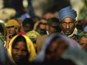 FILE - Members of the audience listen to a speaker at a rally organized by National Conference of Dalit Organisations in New Delhi, India, Sunday, Dec. 5, 2005. Dalits, who belong to the lowest of castes according to the Indian caste system, came from different parts of India to participate in a rally to mark World Dignity Day. Caste is an ancient system of social hierarchy based on one's birth that is tied to concepts of purity and social status. While the definition of caste has evolved over the centuries, under Muslim and British rule, the suffering of those at the bottom of the caste pyramid - known as Dalits, which in Sanskrit means broken -- has continued.