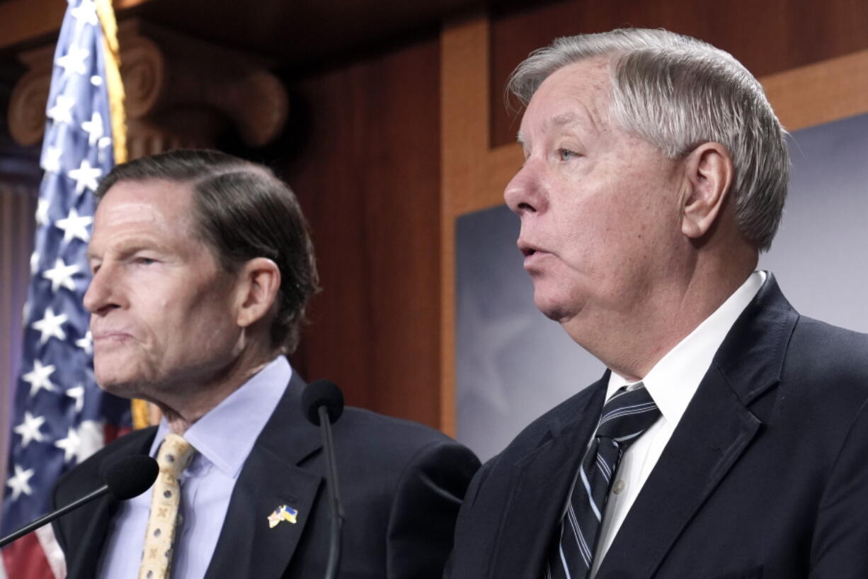 Sen. Lindsey Graham, R-S.C., right, Sen. Richard Blumenthal, D-Conn., left, speak during a news conference on legislation labeling the Russian Wagner Group as one of the Foreign Terrorist Organizations, Thursday, Feb. 16, 2023, on Capitol Hill in Washington.