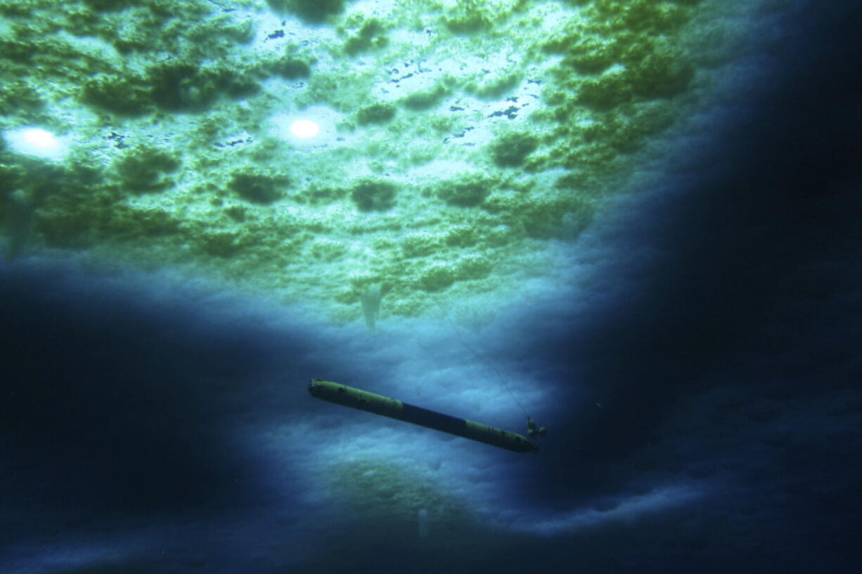 A robot nicknamed Icefin operates under the sea ice near McMurdo Station in Antarctica in 2020. The pencil-shaped robot is giving scientists their first look at the forces eating away at the Thwaites glacier. Two studies published Wednesday, Feb. 15, 2023, show the rate of melting isn't as fast as feared, but fracturing is taking the heaviest toll on the glacier.