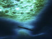 A robot nicknamed Icefin operates under the sea ice near McMurdo Station in Antarctica in 2020. The pencil-shaped robot is giving scientists their first look at the forces eating away at the Thwaites glacier. Two studies published Wednesday, Feb. 15, 2023, show the rate of melting isn't as fast as feared, but fracturing is taking the heaviest toll on the glacier.