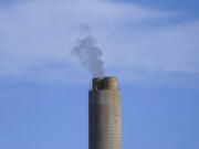 FILE - A smokestack stands at a coal plant on June 22, 2022, in Delta, Utah. The U.S. Environmental Protection Agency on Friday, Feb. 17, 2023, reaffirmed the basis for a rule that requires "significant reductions" in mercury and other harmful pollutants from power plants, reversing a move late in former President Donald Trump's administration to roll back emissions standards.