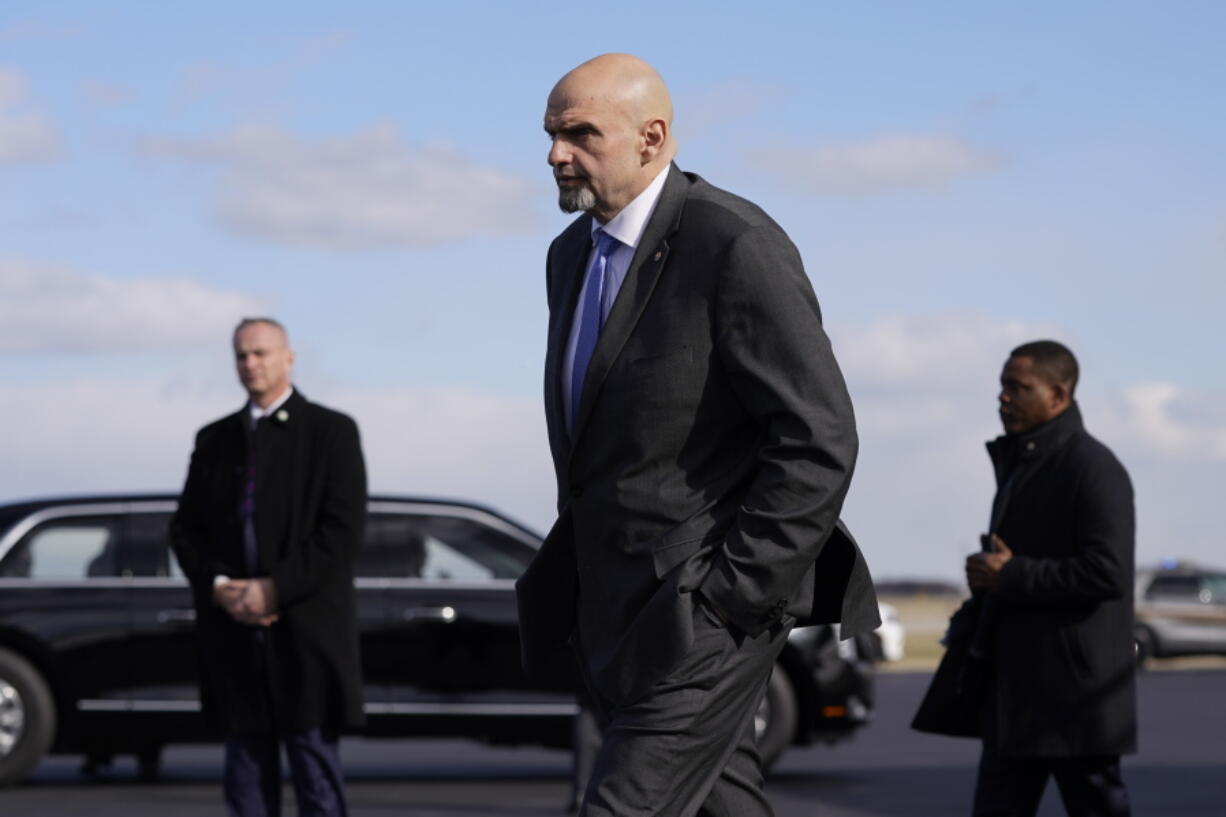 FILE - Sen. John Fetterman, D-Pa., walks to a motorcade vehicle after stepping off Air Force One behind President Joe Biden, Feb. 3, 2023, at Philadelphia International Airport in Philadelphia. On Thursday, Feb.