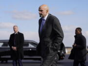 FILE - Sen. John Fetterman, D-Pa., walks to a motorcade vehicle after stepping off Air Force One behind President Joe Biden, Feb. 3, 2023, at Philadelphia International Airport in Philadelphia. On Thursday, Feb.