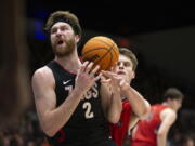 Gonzaga forward Drew Timme (2) is fouled by Saint Mary's center Mitchell Saxen (11) as he drive the lane during the first half of an NCAA college basketball game, Saturday, Feb. 4, 2023, in Moraga, Calif. (AP Photo/D.