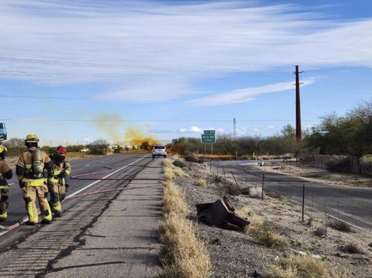 This image provided by the Arizona Department of Public Safety shows what the department says was an accident involving a commercial tanker truck that caused a hazardous material to leak onto Interstate 10 outside Tucson, Ariz., on Tuesday, Feb. 14, 2023, prompting state troopers to shut down traffic on the freeway.