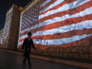 FILE - An image of the U.S. flag is projected on the walls of Jerusalem's Old City in honor of President Joe Biden's visit to Jerusalem, Wednesday, July 13, 2022. Several U.S. Jewish leaders are sounding alarms about what they see as a threat to Israel's democracy posed by its new government, the Likud party led by Benjamin Netanyahu who took office in December 2022, fearing it will erode the independence of its judiciary and legal protections for minority groups.