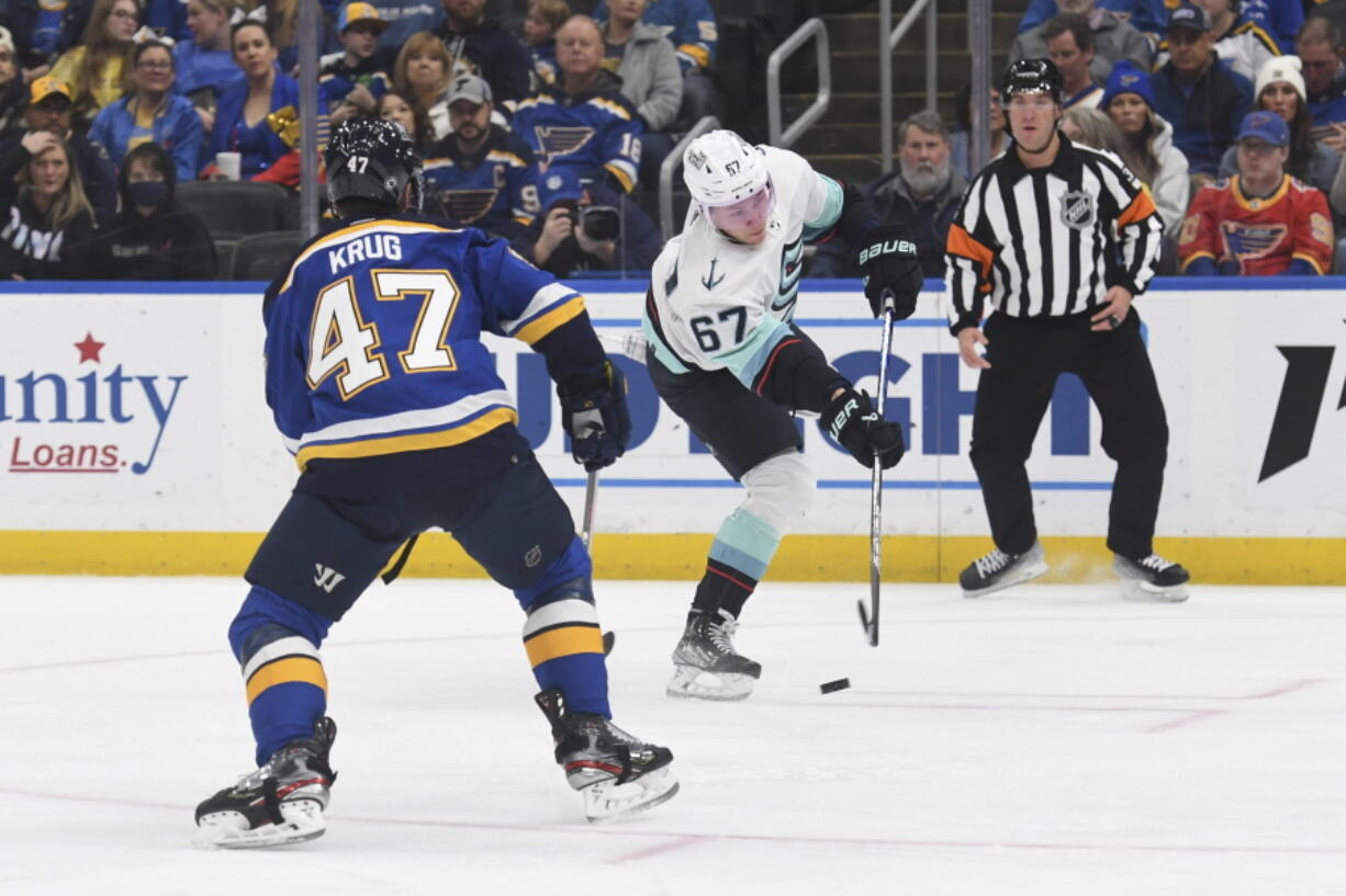 Seattle Kraken's Morgan Geekie (67) shoots a goal against St. Louis Blues' Torey Krug (47) during the first period of an NHL hockey game on Tuesday, Feb. 28, 2023, in St. Louis.