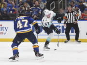 Seattle Kraken's Morgan Geekie (67) shoots a goal against St. Louis Blues' Torey Krug (47) during the first period of an NHL hockey game on Tuesday, Feb. 28, 2023, in St. Louis.
