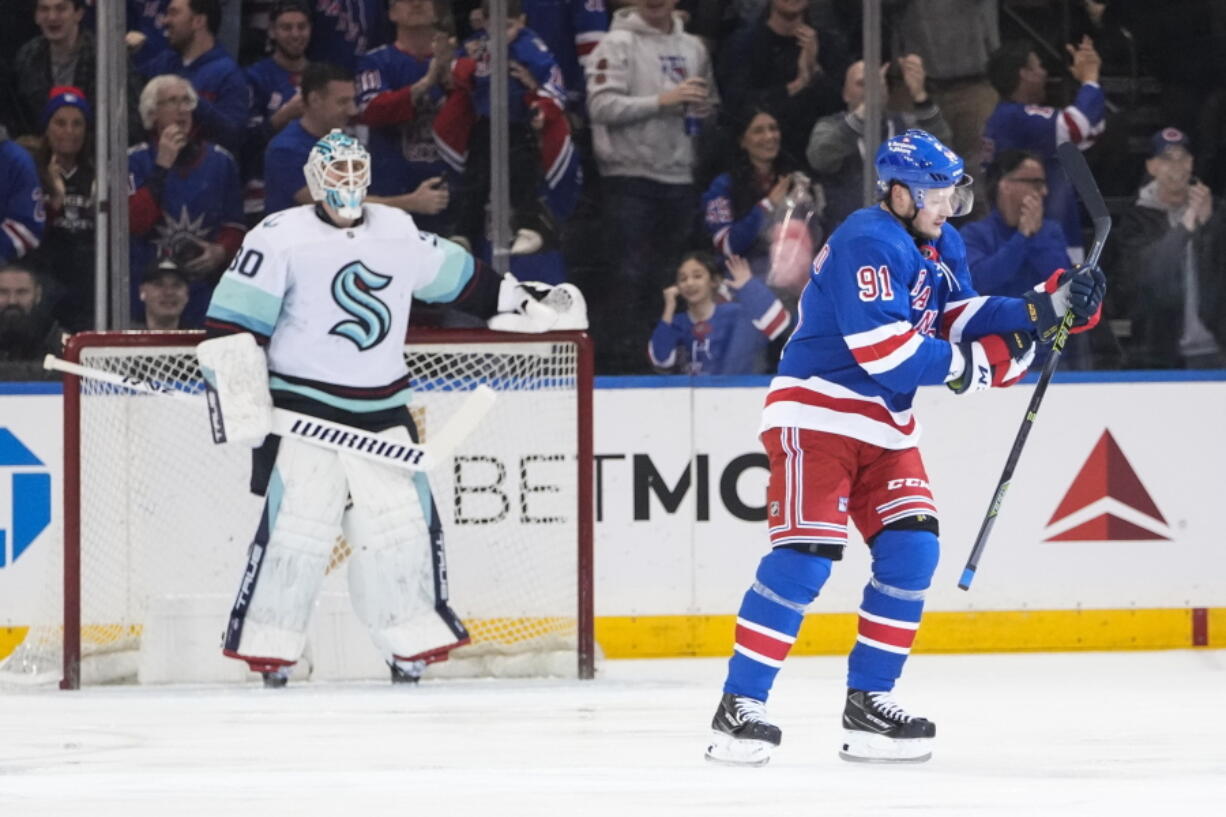 New York Rangers' Vladimir Tarasenko (91) skates past Seattle Kraken goaltender Martin Jones (30) after scoring during the first period of an NHL hockey game Friday, Feb. 10, 2023, in New York.