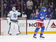 New York Rangers' Vladimir Tarasenko (91) skates past Seattle Kraken goaltender Martin Jones (30) after scoring during the first period of an NHL hockey game Friday, Feb. 10, 2023, in New York.