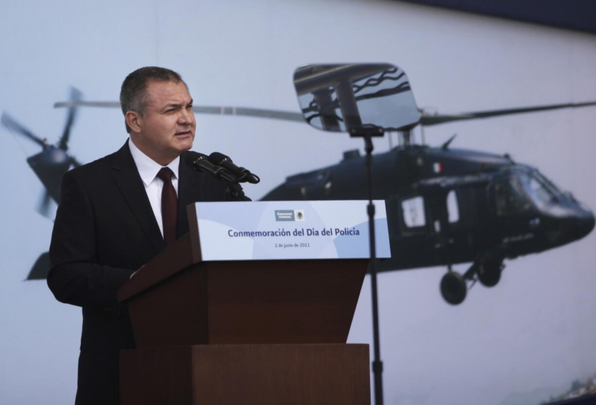 FILE - Mexico's Genaro Garcia Luna speaks during a ceremony to designate June 2 as Federal Police Day in Mexico City, June 2, 2011. Mexican authorities said Feb. 9, 2023 that the former top security official allegedly embezzled as much as $745 million from government technology contracts.