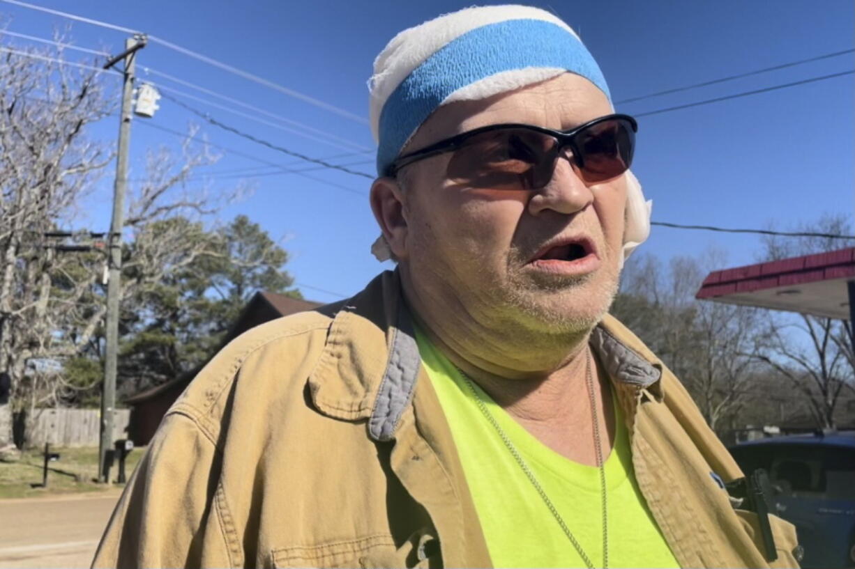 George Drane, who survived a mass shooting Friday that claimed the lives of 6 people, speaks during an interview on Saturday, Feb. 18, 2023, in front of a convenience store where the shootings began in Arkabutla, Miss. Drane's girlfriend, Debra Crum, was the ex-wife of the shooting suspect, Richard Dale Crum.