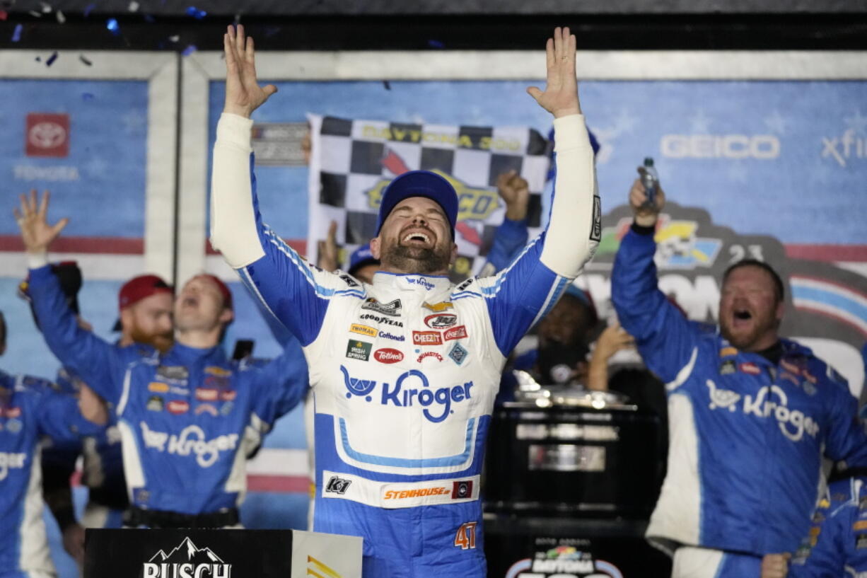 Ricky Stenhouse Jr. celebrates in Victory Lane after winning the NASCAR Daytona 500 auto race at Daytona International Speedway, Sunday, Feb. 19, 2023, in Daytona Beach, Fla.