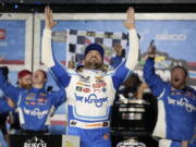 Ricky Stenhouse Jr. celebrates in Victory Lane after winning the NASCAR Daytona 500 auto race at Daytona International Speedway, Sunday, Feb. 19, 2023, in Daytona Beach, Fla.