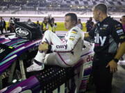 Alex Bowman climbs out of his car during his qualifying run for the NASCAR Daytona 500 auto race Wednesday, Feb. 15, 2023, at Daytona International Speedway in Daytona Beach, Fla. Bowman took the pole position for Sunday's race.