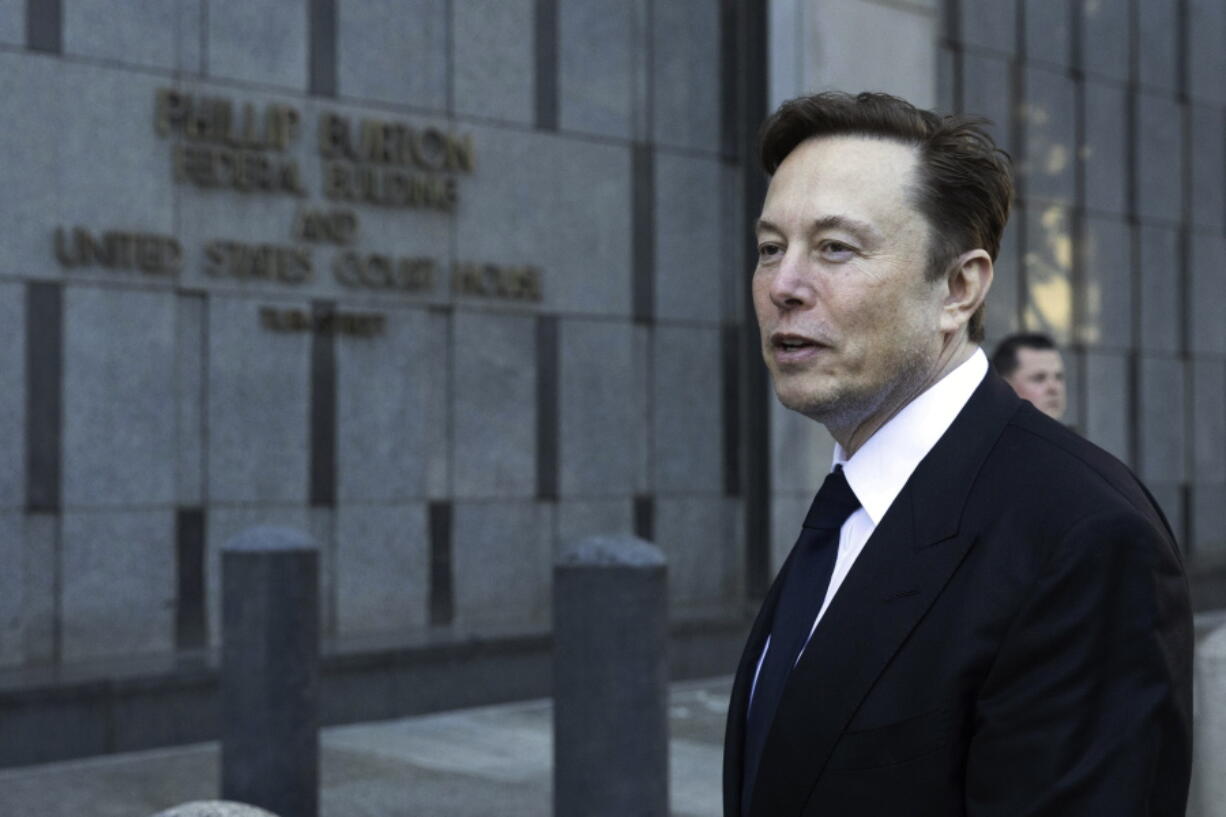 FILE - Elon Musk departs the Phillip Burton Federal Building and United States Court House in San Francisco, on Tuesday, Jan. 24, 2023.  A unit of the U.S. Department of Transportation is conducting an investigation of Neuralink, a brain implant company started by Musk, following claims by an animal rights group that it received information that suggests the company didn't follow proper procedure when shipping potentially hazardous materials, Friday, Feb. 10.