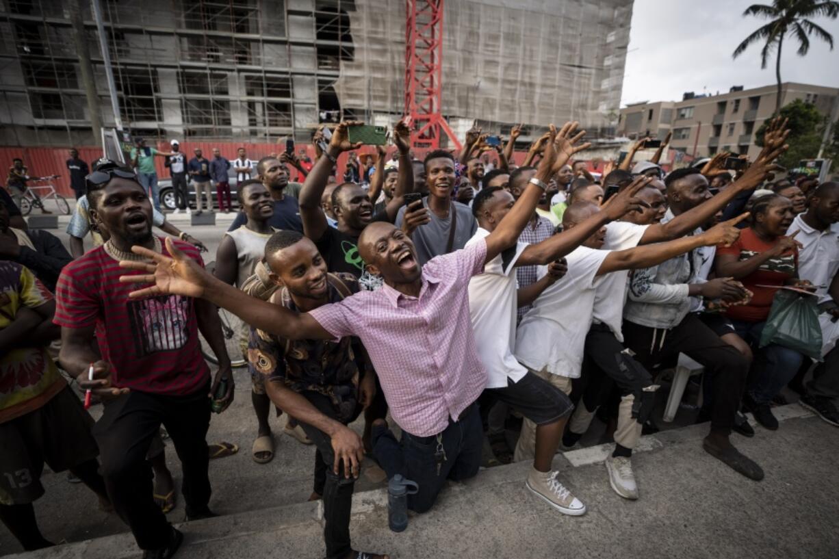 Party agents and supporters of presidential candidate Peter Obi of the Labour Party cheer as their candidate wins the count at a polling station near to the home of ruling party presidential candidate Bola Tinubu, in Lagos, Nigeria Saturday, Feb. 25, 2023. Voters in Africa's most populous nation are heading to the polls Saturday to choose a new president, following the second and final term of incumbent Muhammadu Buhari.