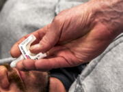 FILE - Attendees practice administering Narcan during an overdose education and Narcan training class at the Onala Recovery Center on the South Shore of Pittsburgh on Monday, Dec. 13, 2021. U.S. health advisers are weighing whether the overdose-reversal drug, Narcan, should be made available as an over-the-counter medication to help fight the national opioid crisis. A panel of experts to the Food and Drug Administration will vote on the switch late Wednesday, Feb. 15, 2023 following hours of presentations and discussions on whether untrained users can follow the instructions to use the antidote in emergency situations.