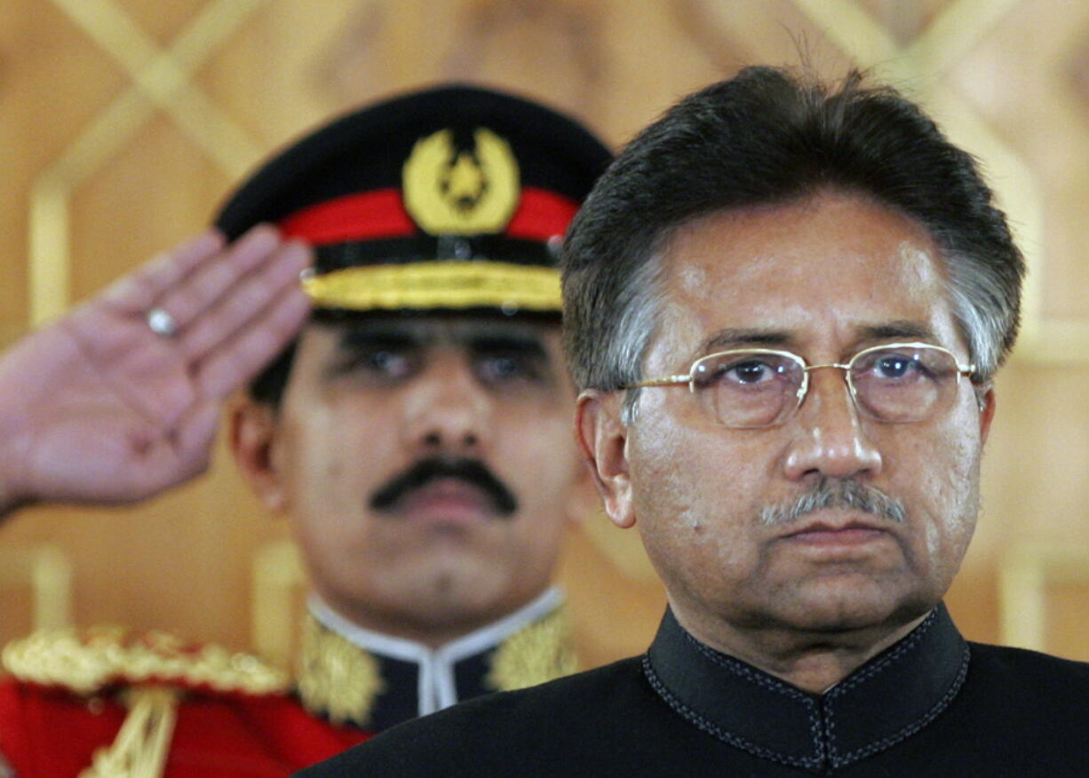 FILE - Pakistan's President Pervez Musharraf listens to the national anthem before being sworn in as the country's civilian president at President House in Islamabad, Pakistan on Nov. 29, 2007. An official said Sunday, Feb. 5, 2023, Gen. Pervez Musharraf, Pakistan military ruler who backed US war in Afghanistan after 9/11, has died.