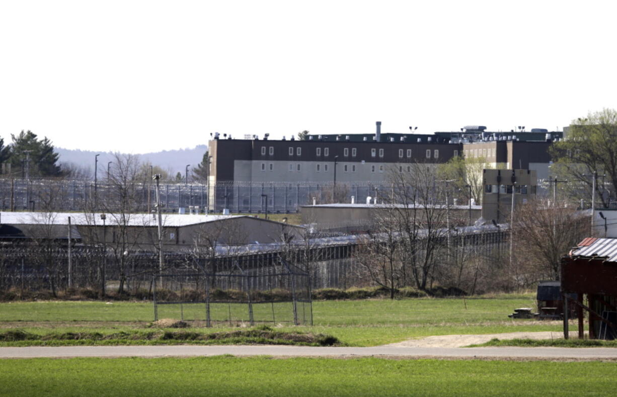 FILE - The Souza-Baranowski Correctional Center is surrounded by fencing, Wednesday, April 19, 2017, in Lancaster, Mass. A proposal to let Massachusetts prisoners donate organs and bone marrow to shave time off their sentence is raising profound ethical and legal questions about putting undue pressure on inmates desperate for freedom.