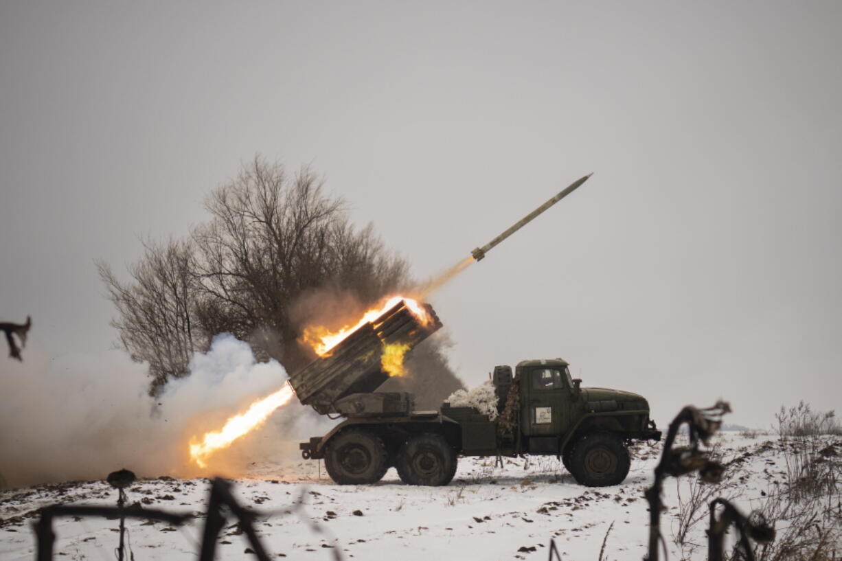 Ukrainian military fires from a multiple rocket launcher at Russian positions in the Kharkiv area, Ukraine, Saturday, Feb. 25, 2023. The Biden administration declared its Ukraine solidarity with fresh action as well as strong words on Friday, piling sweeping new sanctions on Moscow and approving a new $2 billion weapons package to re-arm Kyiv a year after Russia's invasion.