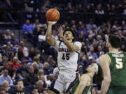 Gonzaga guard Rasir Bolton (45) shoots while defended by San Francisco guard Tyrell Roberts during the second half of an NCAA college basketball game, Thursday, Feb. 9, 2023, in Spokane, Wash.