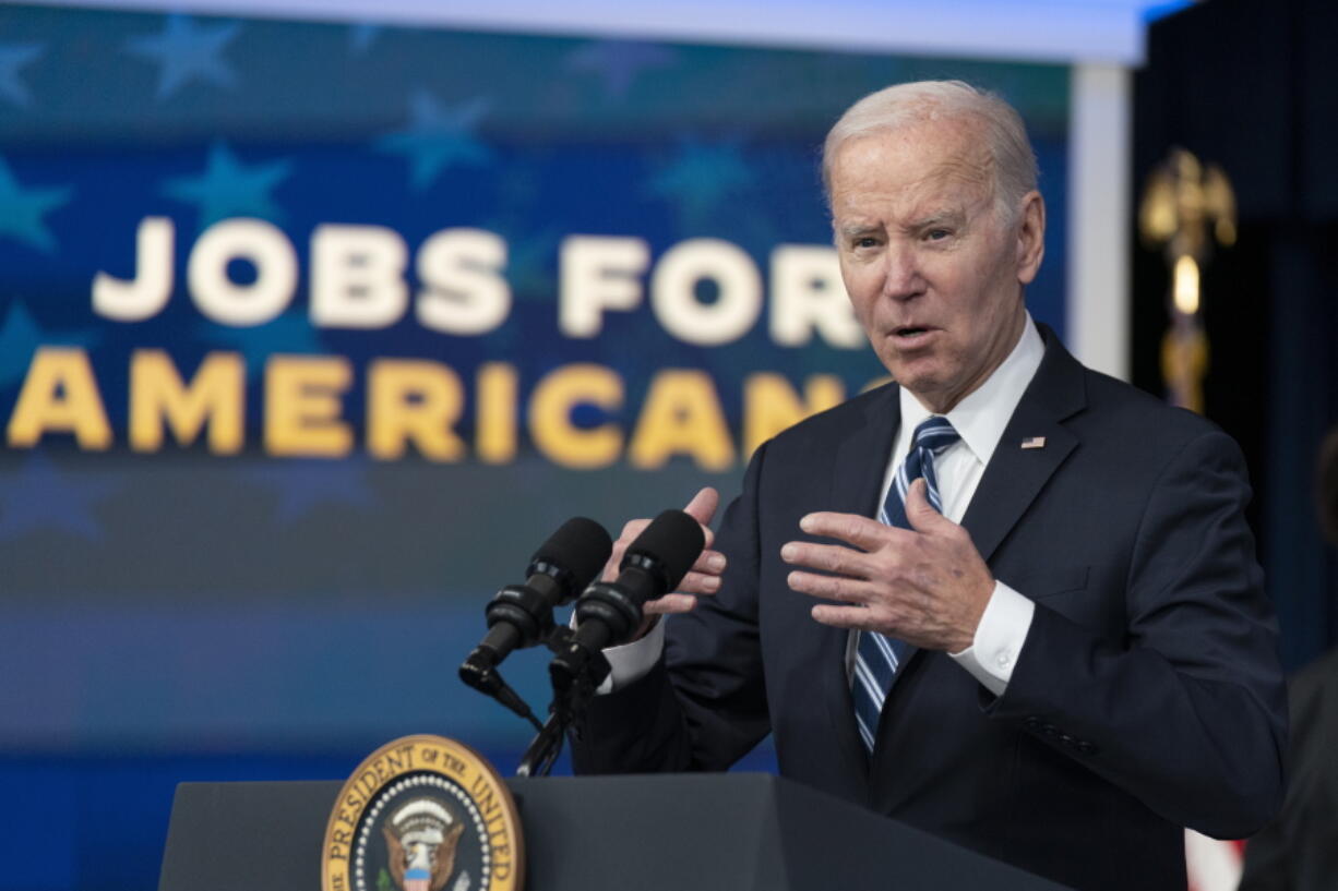 FILE - President Joe Biden speaks on the January jobs report in the Eisenhower Executive Office Building on the White House complex, Friday, Feb. 3, 2023, in Washington. Going into Tuesday's State of the Union address, Biden sees a nation with its future aglow. Republicans take a far bleaker view.