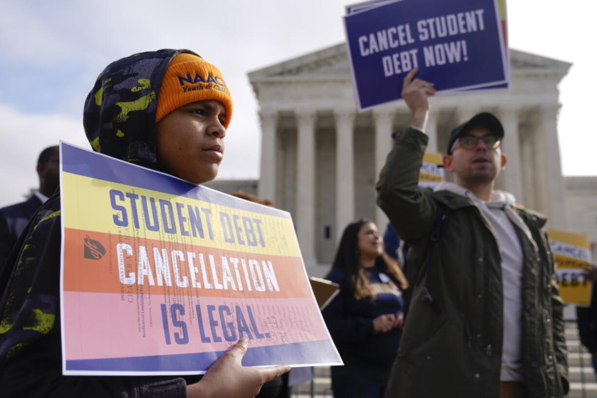 Student debt relief advocates gather outside the Supreme Court on Capitol Hill in Washington, Tuesday, Feb. 28, 2023, ahead of arguments over President Joe Biden's student debt relief plan.