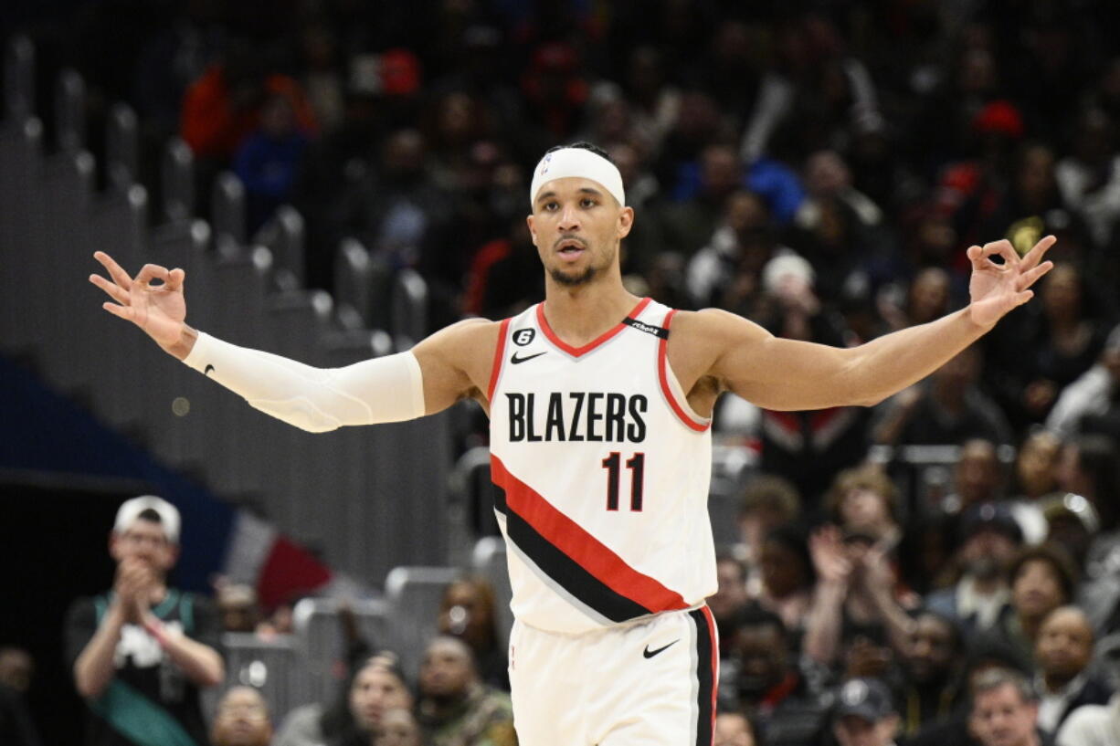 Portland Trail Blazers guard Josh Hart (11) gestures after he made a 3-pointer during the second half of an NBA basketball game against the Washington Wizards, Friday, Feb. 3, 2023, in Washington. The Trail Blazers won 124-116.