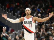 Portland Trail Blazers guard Josh Hart (11) gestures after he made a 3-pointer during the second half of an NBA basketball game against the Washington Wizards, Friday, Feb. 3, 2023, in Washington. The Trail Blazers won 124-116.