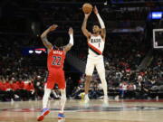 Portland Trail Blazers guard Anfernee Simons (1) shoots against Washington Wizards guard Monte Morris (22) during the second half of an NBA basketball game, Friday, Feb. 3, 2023, in Washington. The Trail Blazers won 124-116.