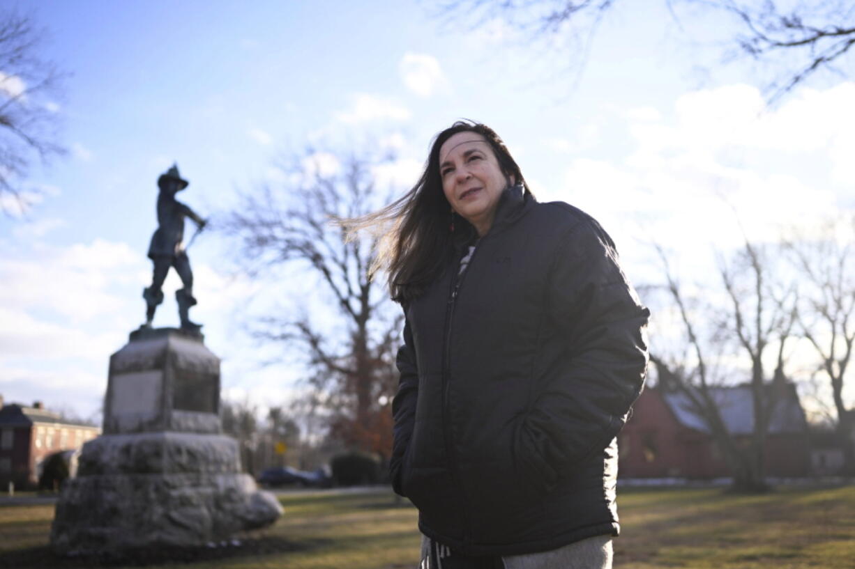 In this Tuesday, Jan. 24, 2023 photo, Beth Caruso, author and co-founder of the CT Witch Trial Exoneration Project, which was created to clear the names of the accused, stands on the Palisado Green in Windsor, Conn., where in 1651, an accident during a local militiamen training exercise led to the accusation of witchcraft and hanging of Lydia Gilbert. Now, more than 375 years later, amateur historians, researchers and descendants of the accused witches and their accusers, from across the U.S., are urging Connecticut officials to officially acknowledge this dark period of the state's colonial history and posthumously exonerate those wrongfully accused and punished.