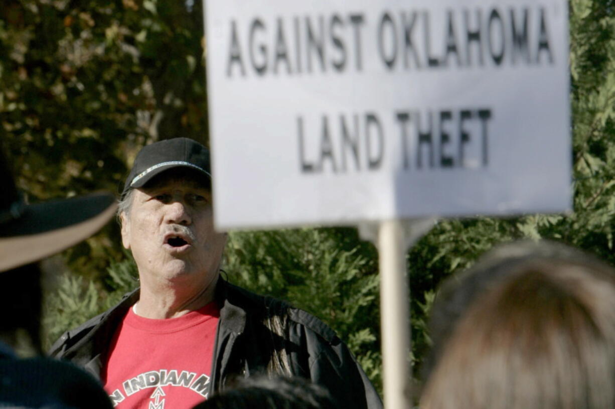 FILE - Dwain Camp of Ponca City, Okla. speaks Friday, Nov. 16, 2007 in Oklahoma City, during the Oklahoma Indians Survival Walk and Remembrance Ceremony near the state Capitol. Camp, a member of the Ponca Tribe of Oklahoma, was in California when his younger brother, Carter, called to say he and other leaders of the American Indian Movement took a group of activists into Wounded Knee in 1973. "He was telling me they were in a hell of a fight," Camp, now 85, recalled. "I heard the gunfire and that was all I needed.