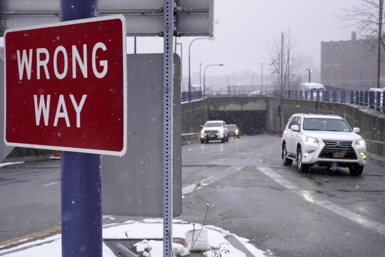 A "Wrong "Way" sign warns drivers from entering westbound on an eastbound exit ramp from the Massachusetts Turnpike, Route I-90, in Boston, Thursday, Feb. 23, 2023. Massachusetts transportation officials have launched a new program designed to curb the number of wrong-way driving deaths in the state. The $2.6 million pilot program project set up in November 2022, consists of installing wrong-way vehicle detection systems at highway ramps across the state. Each year in the United States, wrong-way crashes result in 300 to 400 deaths.