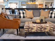 This neutral animal print ottoman shines front and center in this living room design.