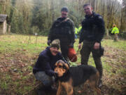 Cowlitz County Deputies Landen Jones, left, and James Doyle after rescuing Nathan Mueller of Vancouver and his dog from a ledge above the Kalama River on Sunday afternoon.