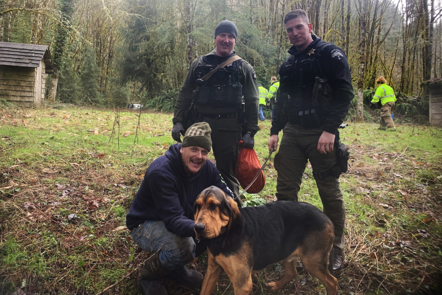 Cowlitz County Deputies Landen Jones, left, and James Doyle after rescuing Nathan Mueller of Vancouver and his dog from a ledge above the Kalama River on Sunday afternoon.