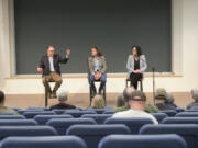 State Sen. Ann Rivers, center, and Reps. Greg Cheney, left, and Stephanie McClintock from the 18th Legislative District engage in conversation Saturday with participants at a town hall at Washington State University Vancouver.