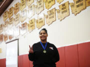 Prairie sophomore Faith Tarrant holds up two fingers for her two state championships in two years of wrestling.